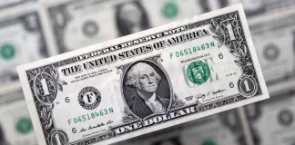 Pakistani rupee gains a bit against US dollar
